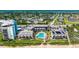 Aerial view of oceanfront condos offering beach access, community pool, parking, and proximity to residential development at 935 Ocean Shore Blvd # 4010, Ormond Beach, FL 32176