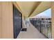 Long balcony with rocking chairs and views of the surrounding condos at 935 Ocean Shore Blvd # 4010, Ormond Beach, FL 32176