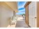 Narrow balcony featuring a table, chairs, and a view of the beach at 935 Ocean Shore Blvd # 4010, Ormond Beach, FL 32176