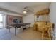 Game room with a ping pong table, bamboo bar with barstools, and a door leading to the balcony at 935 Ocean Shore Blvd # 4010, Ormond Beach, FL 32176