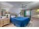 Stylish main bedroom featuring bright decor, a ceiling fan, and ample storage and side tables at 935 Ocean Shore Blvd # 4010, Ormond Beach, FL 32176