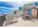 Spacious rooftop deck with outdoor seating, lounge chairs, and city views at 935 Ocean Shore Blvd # 4010, Ormond Beach, FL 32176