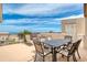 Rooftop deck with lounge chairs, table with seating, and ocean views at 935 Ocean Shore Blvd # 4010, Ormond Beach, FL 32176