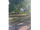 Picture of a large backyard with mature trees and partial sunlight at 1031 Tony Cir, St Cloud, FL 34772