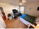 Inviting bedroom with a window and space for a desk and chair at 1031 Tony Cir, St Cloud, FL 34772