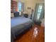 This bedroom has hardwood floors, lots of natural light, and a calming color palette at 1031 Tony Cir, St Cloud, FL 34772