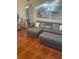 Comfortable living room featuring a gray sofa and patterned pillows at 1031 Tony Cir, St Cloud, FL 34772