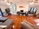 Spacious open-concept living room and dining area with tile flooring at 1031 Tony Cir, St Cloud, FL 34772