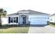 Charming single-story home with stone accents, brick paved drive, and well-maintained landscaping at 1077 Chelan Falls N Trl, Deland, FL 32724