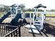 Community playground with slides, stairs and platforms for outdoor fun at 1077 Chelan Falls N Trl, Deland, FL 32724