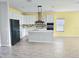 Bright kitchen featuring an island, stainless steel appliances, and an open concept layout at 1077 Chelan Falls N Trl, Deland, FL 32724