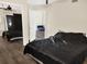 Bedroom with hardwood floors, closet with mirror doors, and ensuite bathroom at 1118 Meditation Loop, Port Orange, FL 32129