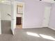 Bedroom with grey tile flooring that leads to a bathroom at 1118 Meditation Loop, Port Orange, FL 32129