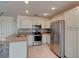 Modern kitchen featuring stainless steel appliances, light cabinets, and plenty of counter space at 1118 Meditation Loop, Port Orange, FL 32129