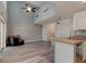 Bright living space with high ceilings, wood floors, open to kitchen area, and natural light at 1118 Meditation Loop, Port Orange, FL 32129