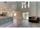 Bright living space with high ceilings, wood floors, and sliding glass doors to outdoor patio at 1118 Meditation Loop, Port Orange, FL 32129