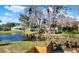Scenic view of the property's pond, showcasing the lush backyard and neighborhood surroundings at 1118 Meditation Loop, Port Orange, FL 32129