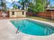 The pool features a concrete surround, a storage shed and a grill at 1118 Meditation Loop, Port Orange, FL 32129