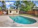 The pool features a concrete surround, a storage shed and a grill at 1118 Meditation Loop, Port Orange, FL 32129