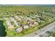 This aerial perspective reveals the building's proximity to a major roadway, complemented by mature trees at 116 Moonstone Ct, Port Orange, FL 32129