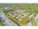 An aerial shot features the building next to a community pool and easy access to a nearby thoroughfare at 116 Moonstone Ct, Port Orange, FL 32129