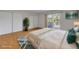 Bedroom featuring bed with balcony access, sliding closet doors, and a potted plant at 116 Moonstone Ct, Port Orange, FL 32129