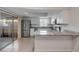 Well-lit kitchen featuring stainless steel appliances and granite countertops at 116 Moonstone Ct, Port Orange, FL 32129