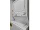 Stacked washer and dryer unit with controls and energy guide label at 116 Moonstone Ct, Port Orange, FL 32129