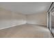 Spacious room with tile flooring and a sliding glass door at 116 Moonstone Ct, Port Orange, FL 32129