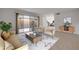 Staged living room with modern decor and a view to an outdoor patio at 116 Moonstone Ct, Port Orange, FL 32129
