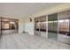 Spacious enclosed patio with tile flooring and sliding glass doors to the interior at 116 Moonstone Ct, Port Orange, FL 32129