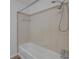Bathroom shower featuring a showerhead, white tile, and neutral accents at 116 Moonstone Ct, Port Orange, FL 32129