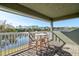 Scenic balcony view with comfortable seating to enjoy water views at 1204 Draycott St, Ormond Beach, FL 32174