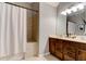 Bathroom with double sinks and a tiled walk-in shower at 1204 Draycott St, Ormond Beach, FL 32174