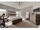 Bright bedroom featuring a textured bed frame, large mirror, and neutral tones at 1204 Draycott St, Ormond Beach, FL 32174