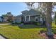 This single Gathering home boasts a well-manicured lawn, elegant landscaping, and an inviting facade at 1204 Draycott St, Ormond Beach, FL 32174