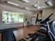 Community gym area with exercise equipment, ceiling fans and large windows with views at 1204 Draycott St, Ormond Beach, FL 32174