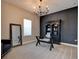 Stylish home office with a black accent wall, built-in bookcase, and neutral carpet at 1204 Draycott St, Ormond Beach, FL 32174