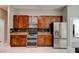Kitchen features stainless steel appliances including refrigerator and double oven and granite countertops at 1204 Draycott St, Ormond Beach, FL 32174
