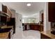 The eat-in kitchen is open to the Gathering room and features granite countertops and stainless steel appliances at 1204 Draycott St, Ormond Beach, FL 32174