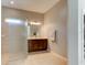Spacious main bathroom features a walk-in shower and double vanity sinks and large mirror at 1204 Draycott St, Ormond Beach, FL 32174