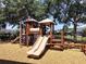 Community playground with slides, climbing structure, and soft, safe wood chip ground cover at 1204 Draycott St, Ormond Beach, FL 32174