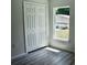 Bedroom with natural light and spacious closet, featuring wood-look floors at 1275 16Th St, Orange City, FL 32763