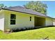 A well-maintained exterior view of the home with a dark roof and manicured lawn at 1275 16Th St, Orange City, FL 32763