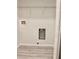 Laundry room featuring washer hookups and wood-look floors, for easy cleaning at 1275 16Th St, Orange City, FL 32763