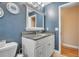 Beautiful bathroom featuring granite countertop, large mirror, and neutral wall color at 1500 Wyngate Dr, Deland, FL 32724