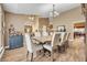 Spacious dining room featuring wood floors, a dining table with seating for eight, and classic decor at 1500 Wyngate Dr, Deland, FL 32724