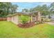 Charming brick home with manicured landscaping and a well-maintained lawn at 1500 Wyngate Dr, Deland, FL 32724