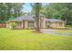 Charming brick home featuring a well-manicured front yard and inviting curb appeal at 1500 Wyngate Dr, Deland, FL 32724