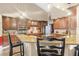 Open kitchen featuring granite counters, breakfast bar seating, and stainless steel appliances at 1500 Wyngate Dr, Deland, FL 32724